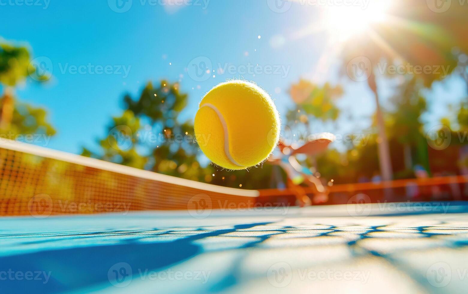 Dynamic view of a pickleball paddle in action during a sunny day at an outdoor court photo