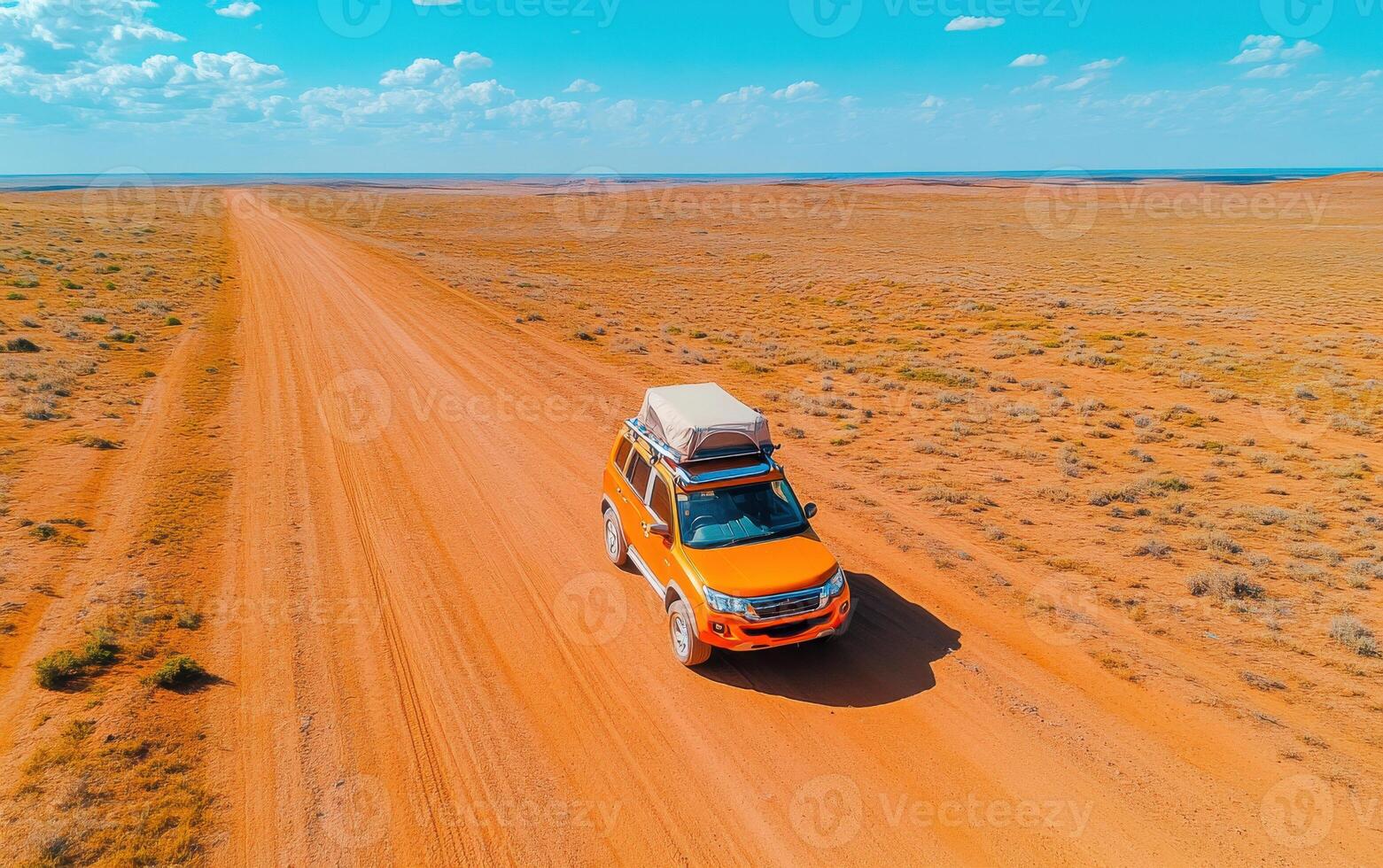 Exploring vast desert landscapes with a small off-road vehicle on a clear sunny day photo
