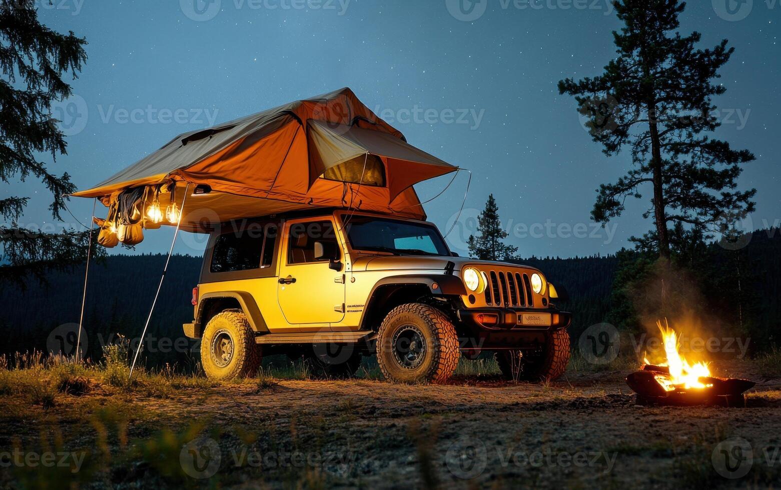 Enjoying a night under the stars with off-road camping and a cozy fire near a mountain landscape photo