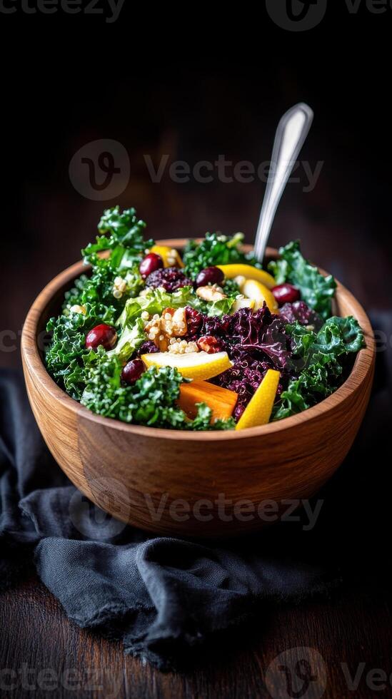 Fresh farm to table salad featuring kale, fruits, nuts, and vibrant colors in a rustic bowl photo