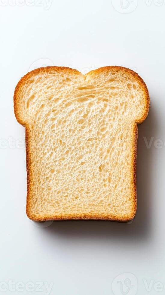 Freshly cut slice of white bread on a white background photo