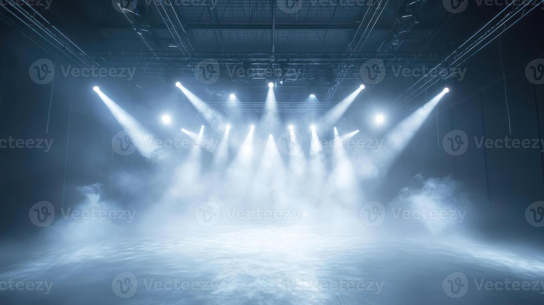 Illuminated stage with bright spotlights and mystical fog in empty theater hall photo