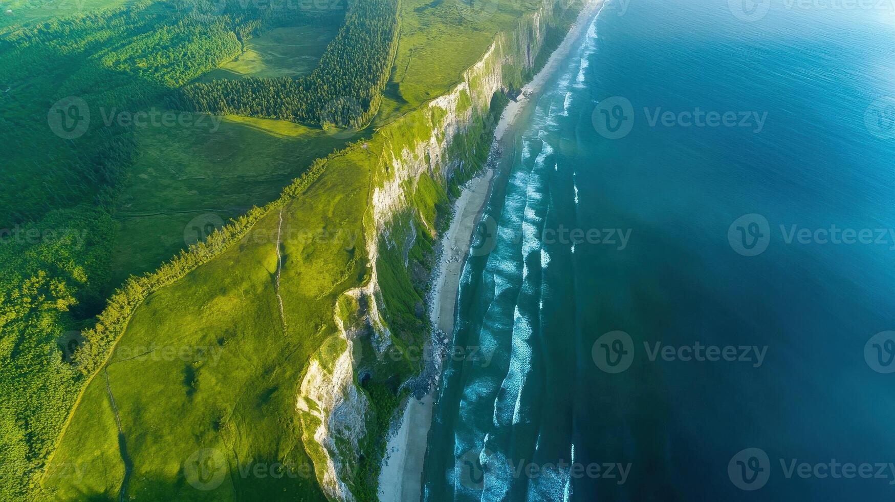 Aerial view of rocky coastline with green cliffs and blue sea waters photo