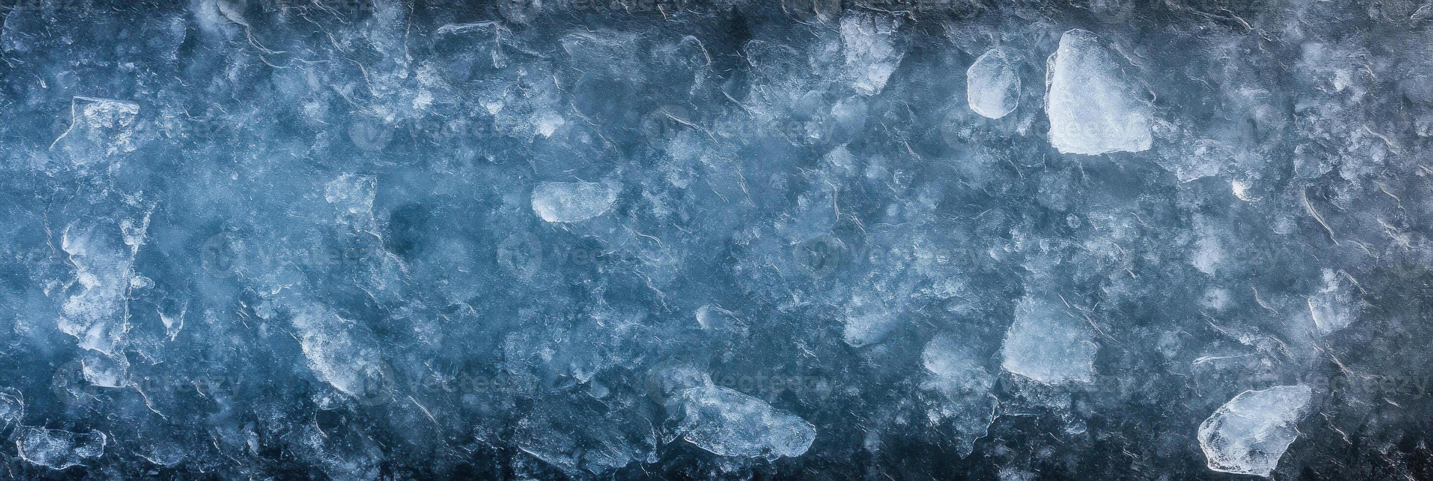 Textured ice surface with crystallized patterns and frozen features photo