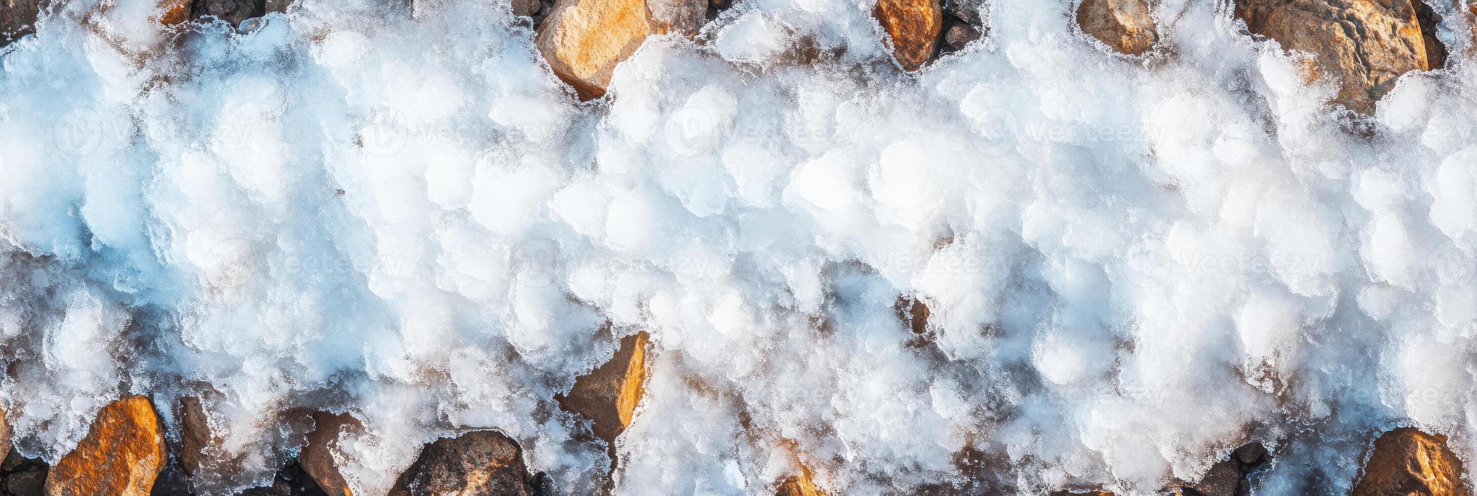 Aerial view of snow-covered rocks creating a unique natural contrast photo