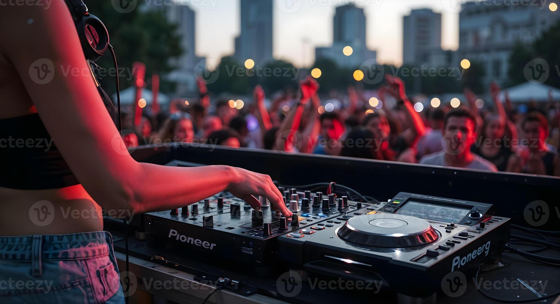 Female DJ Performing at Outdoor Music Festival with Crowd photo