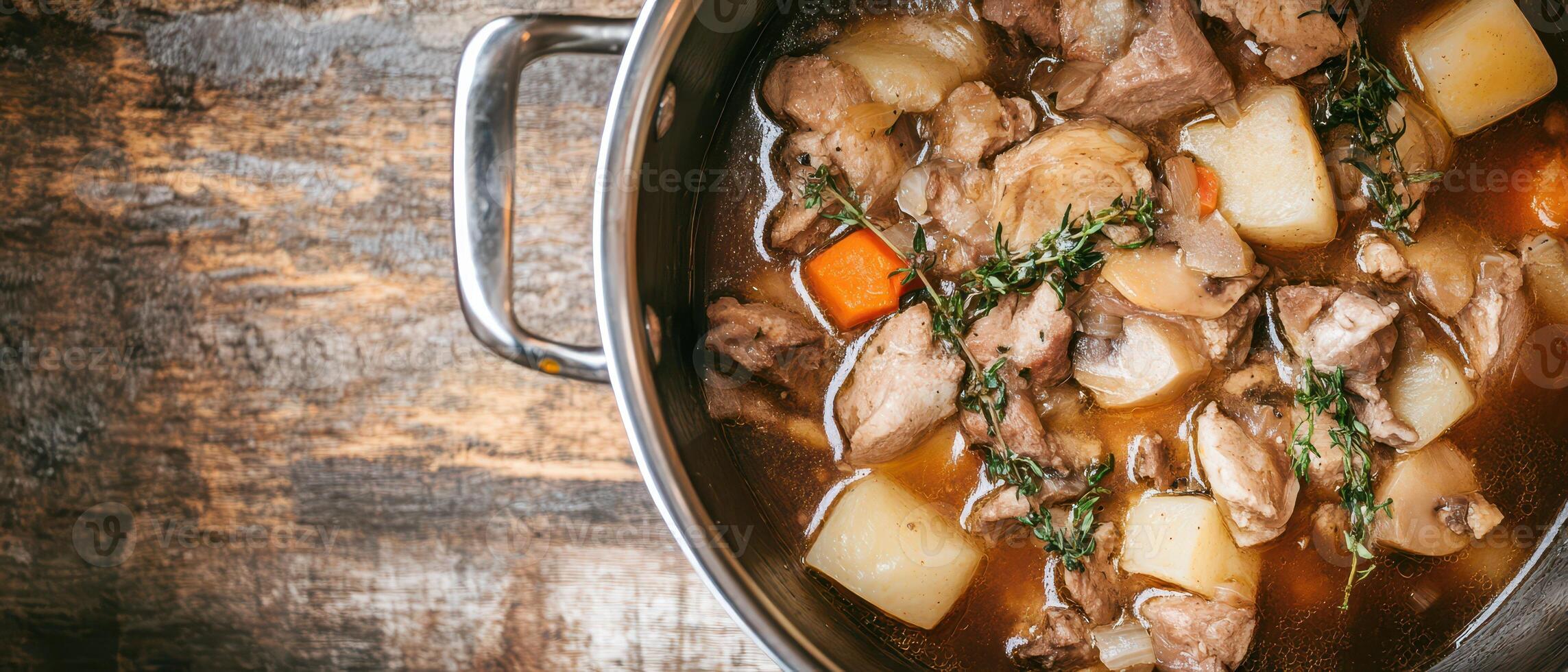 A pot of stew with meat and vegetables photo
