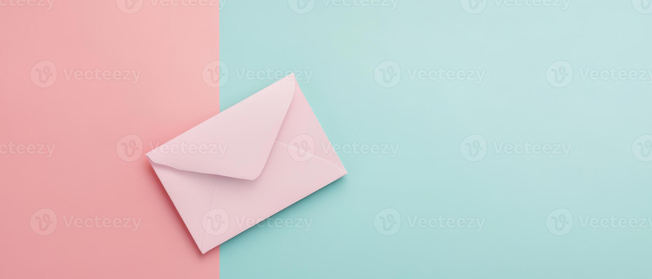 An envelope with pink and blue paper on a pastel background photo