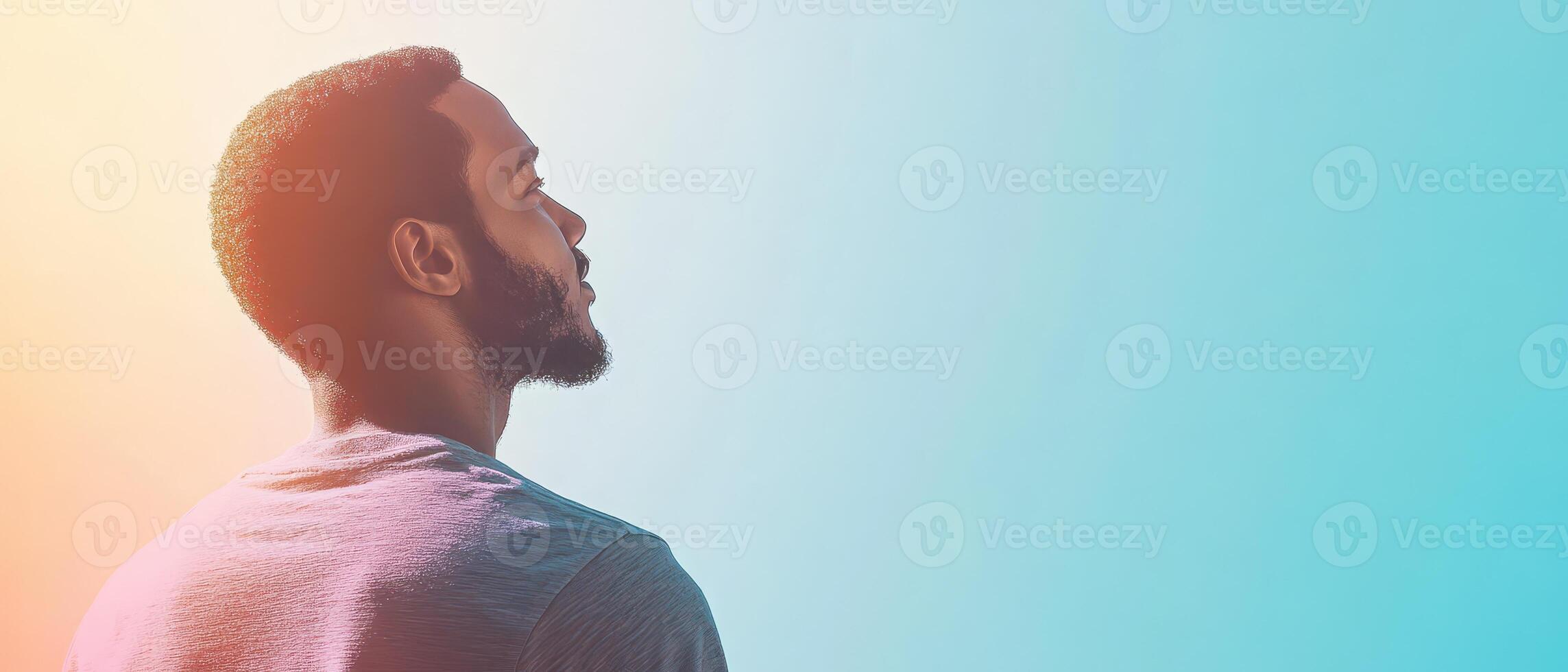 A man is looking up at the sky photo