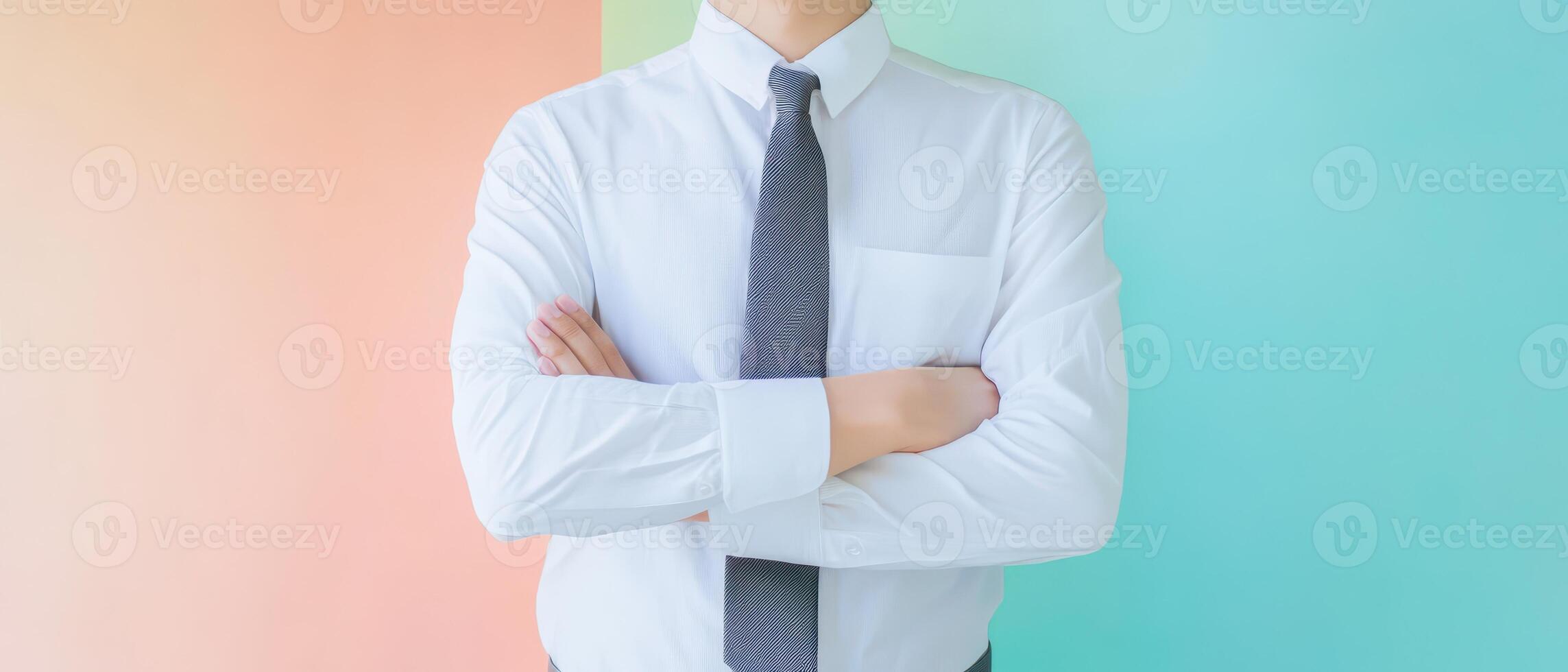 A man in a white shirt and tie standing in front of a colorful background photo