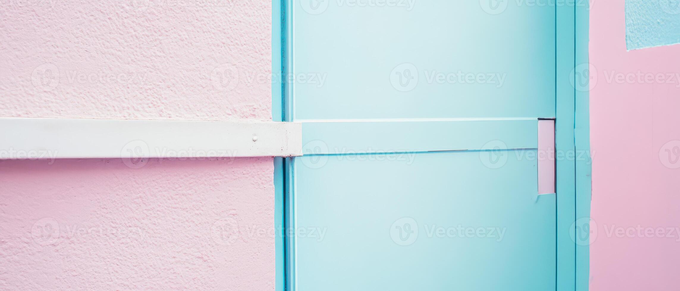 A pink and blue door with a white handle photo