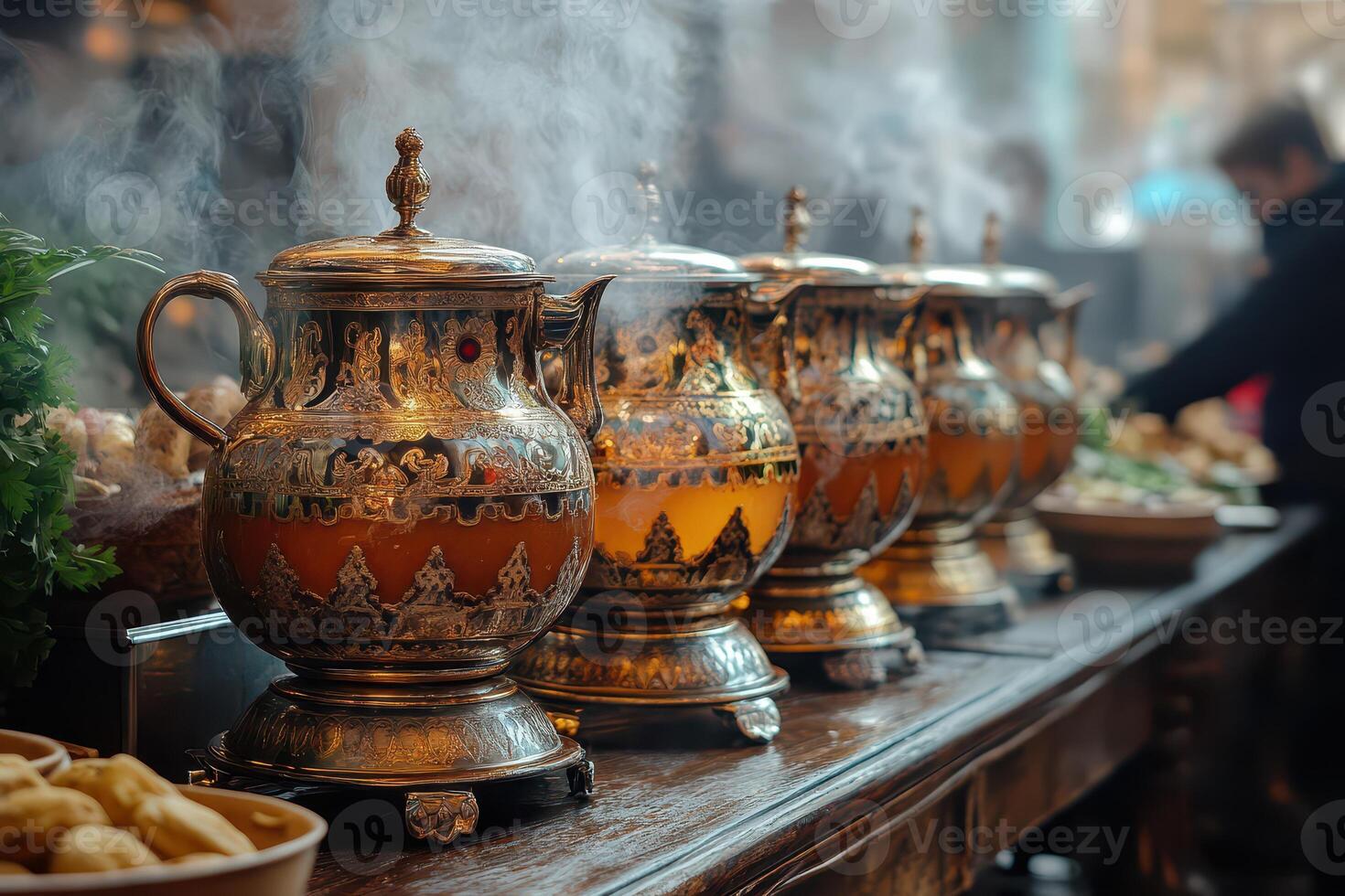 A line of tea pots on a table photo