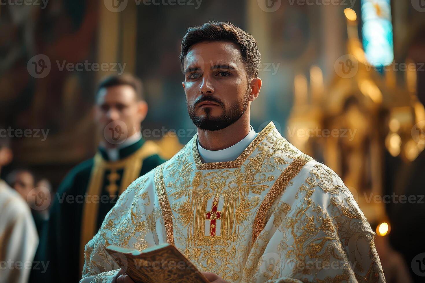 A priest holding a bible in front of other priests photo