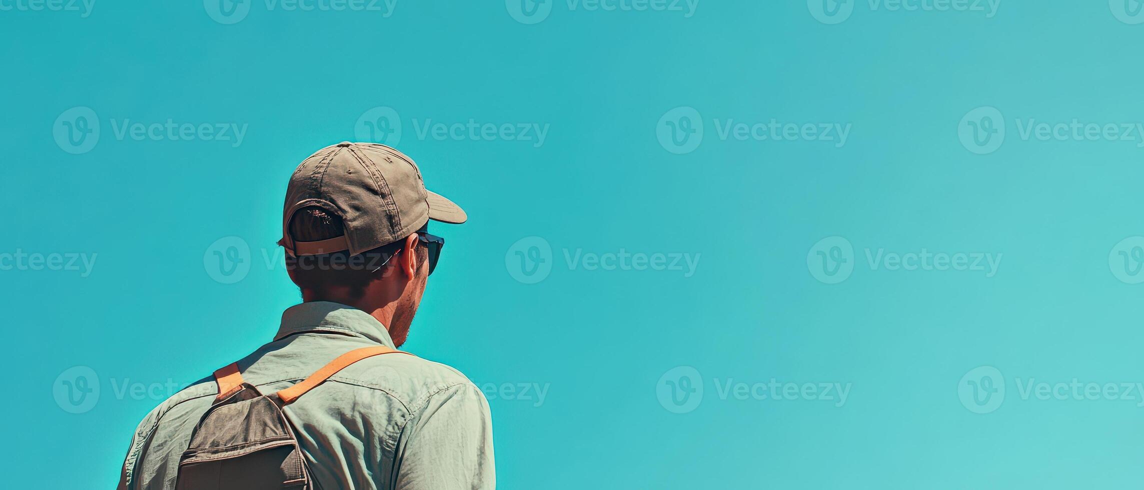 Man enjoying a sunny day under a clear blue sky photo