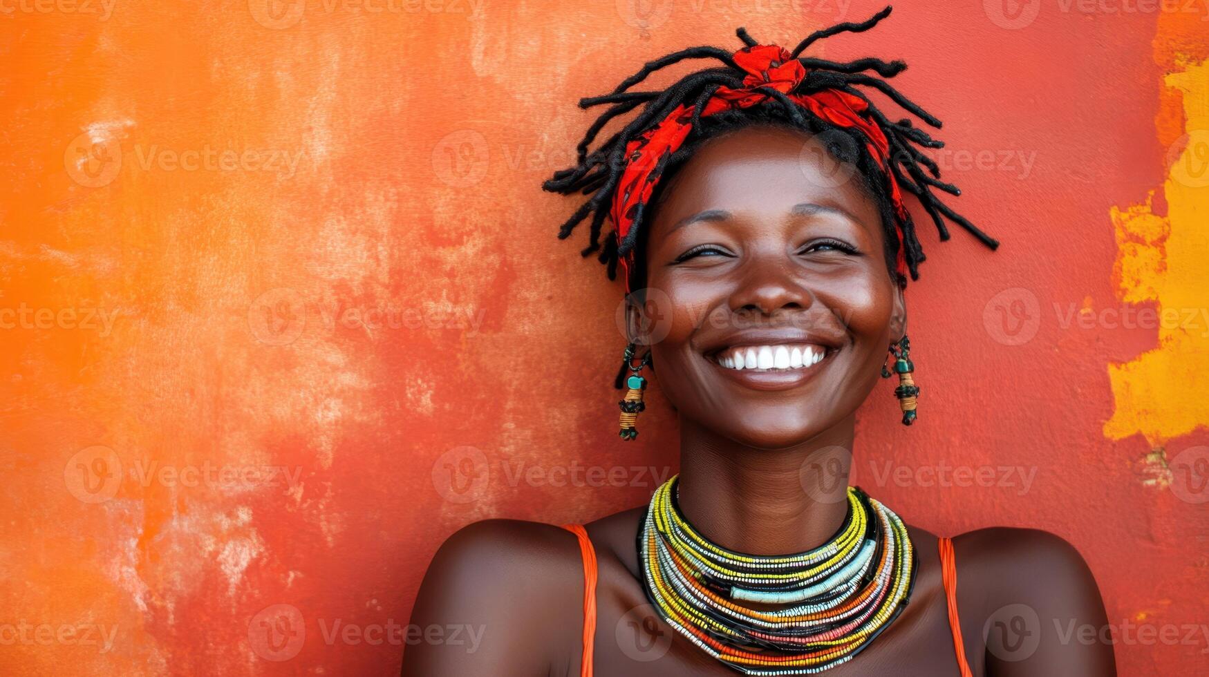 Joyful Dark Skinned Woman Smiling with Red Headband and Colorful Necklace Beauty Portrait photo