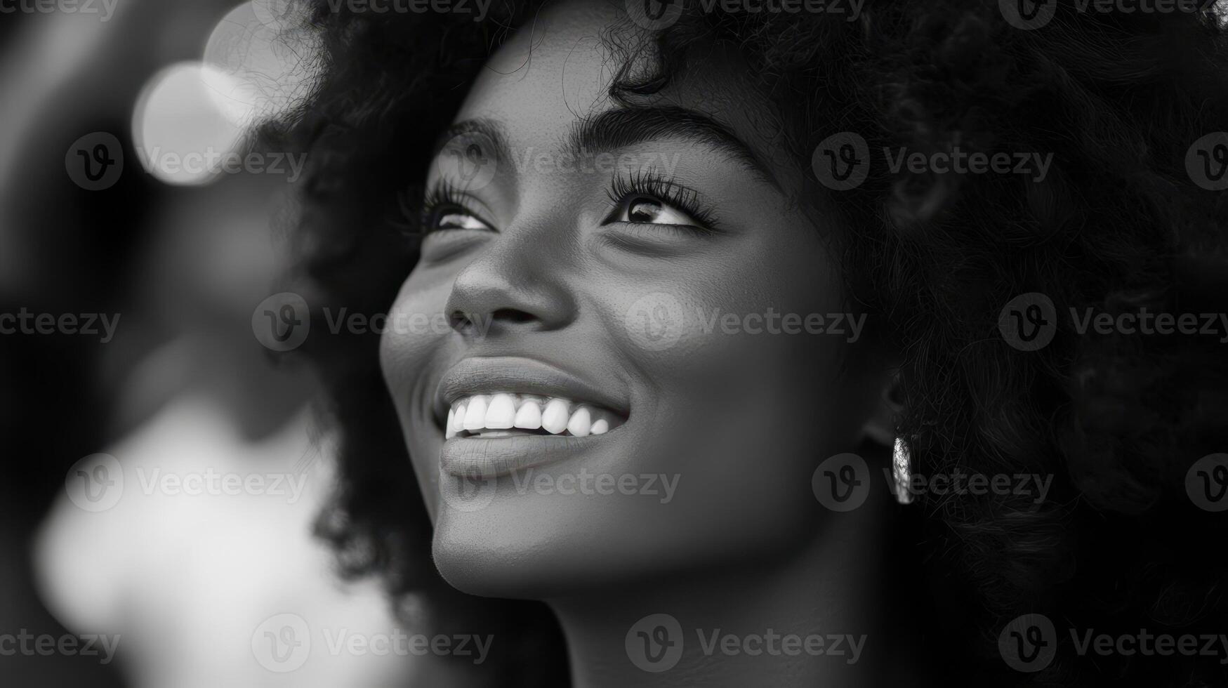 Smiling Woman's Upward Gaze, Black and White Portrait Beauty and Joy photo