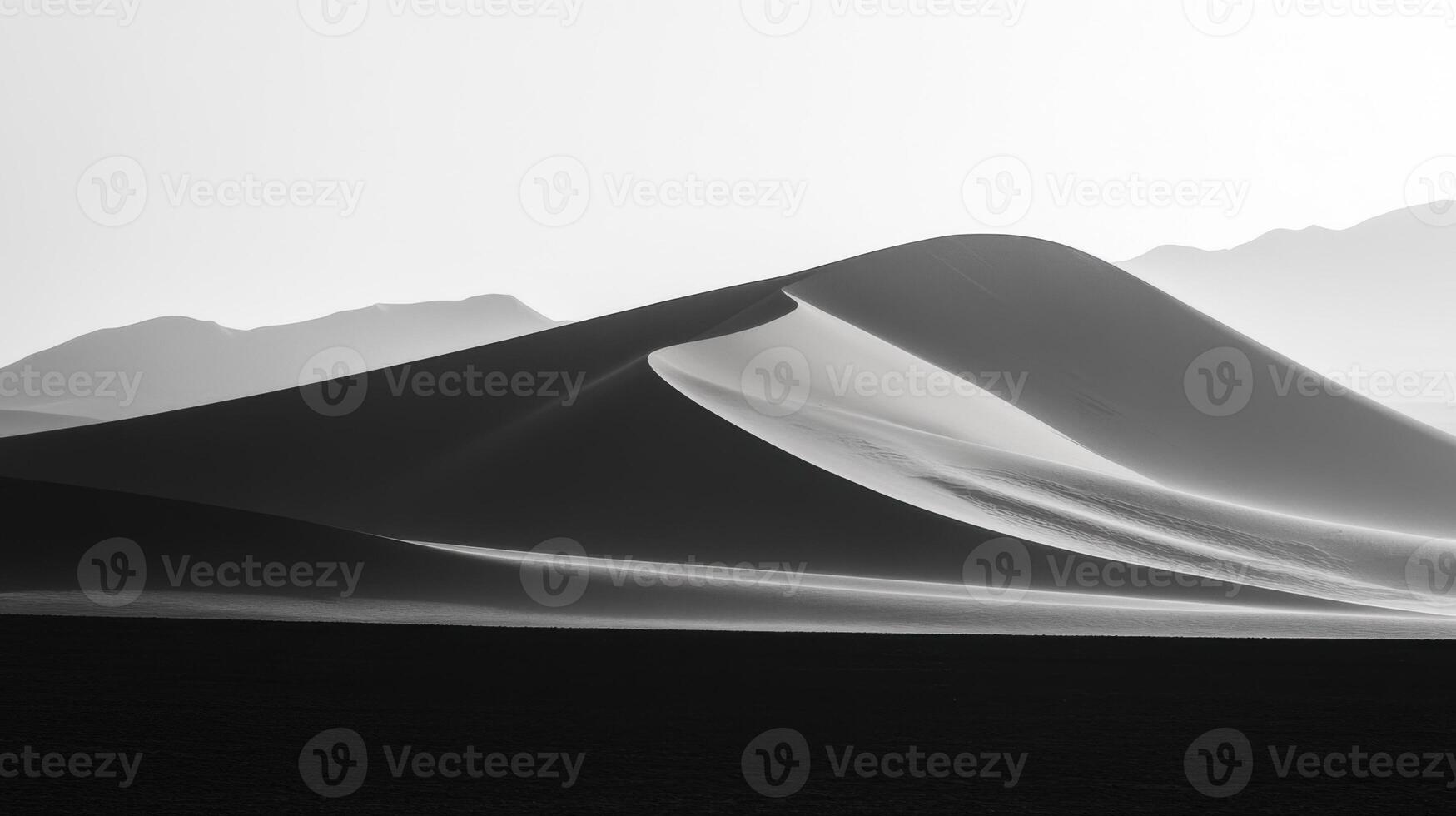 Sand dune. Desert landscape. Arid land. Nature scenery. Black and white. Hill shadow. Arid climate. Land feature. Earth pattern. Mountain horizon. photo