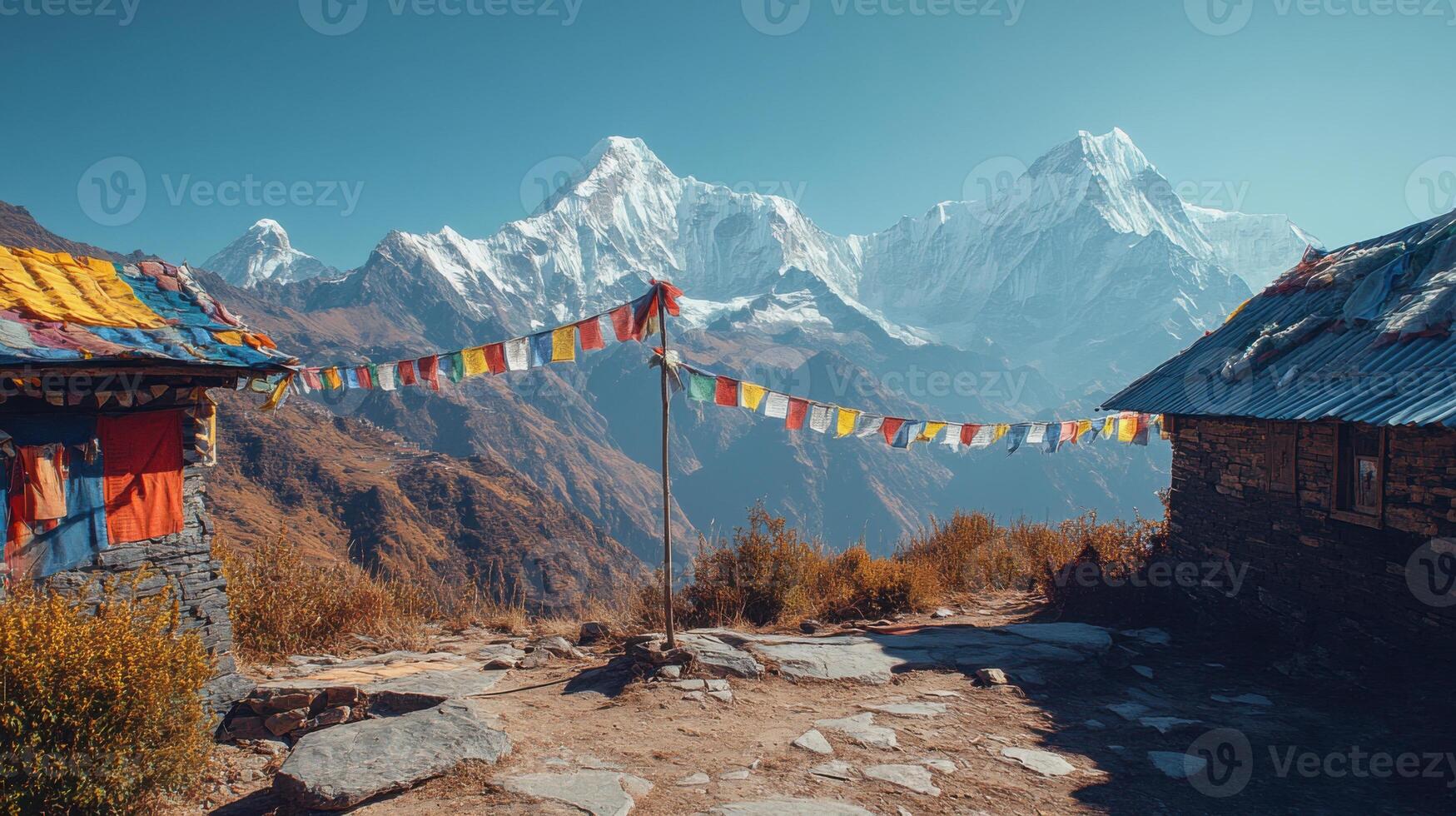 Mountain Peak View. Prayer flags blowing. Small stone huts along a trail. Blue sky. Wonderful adventure. Beautiful nature. photo