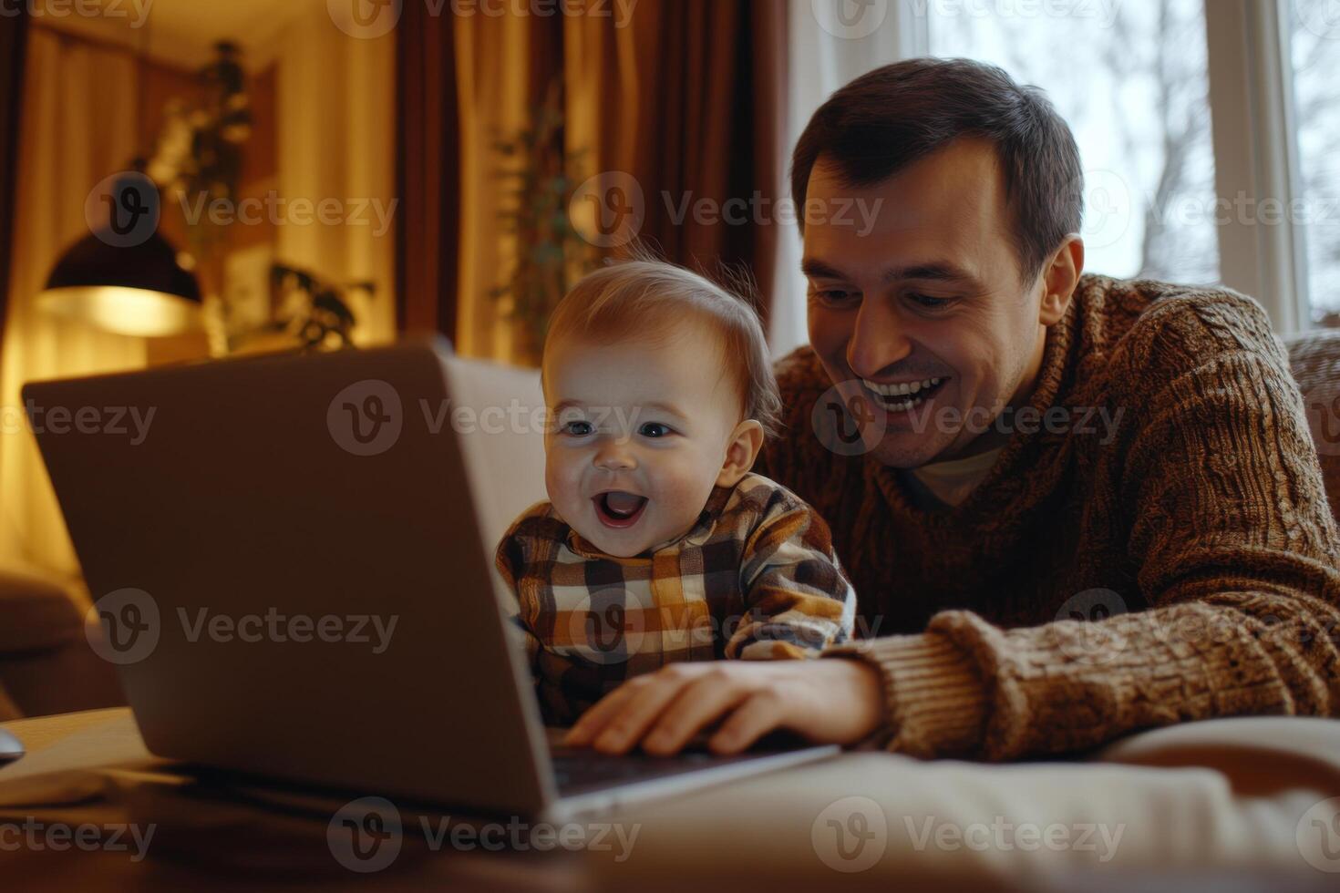 Man and baby look at laptop screen. Happy child touches the keyboard. Bright light in cozy room. Smiling faces looking at technology. photo