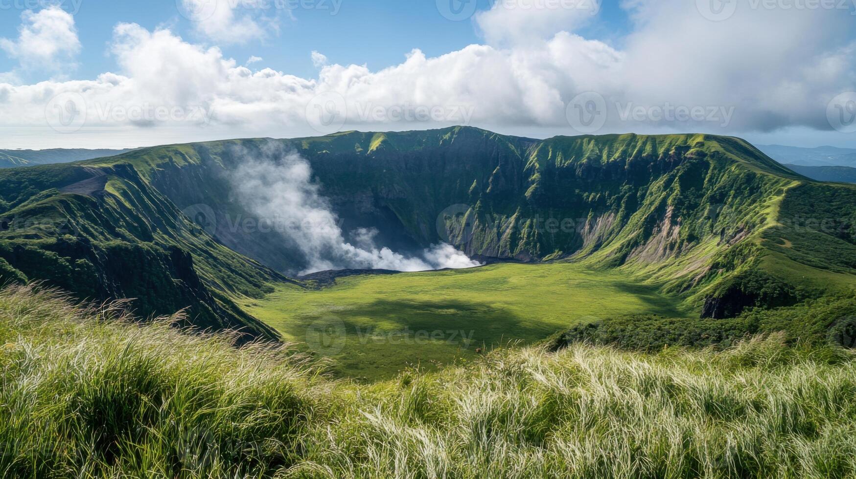 Lush green volcanic crater with steam rising. Tall grass in foreground. Mountain landscape under a bright sky with white clouds. Beautiful nature scenic view. photo