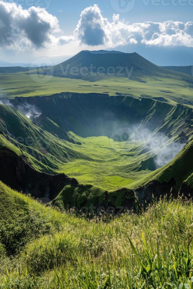 Green grassy volcano crater with steam inside on a sunny day. Beautiful open landscape with mountain view and blue sky. photo