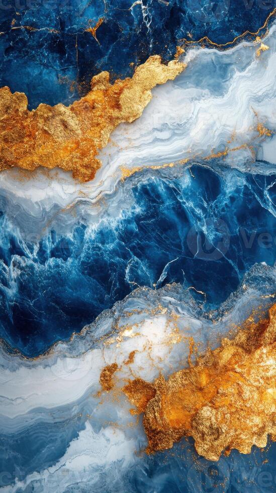 Abstract art with blue and white liquid texture and gold paint. Waves swirl and create unique patterns. Paint runs freely in this background. photo