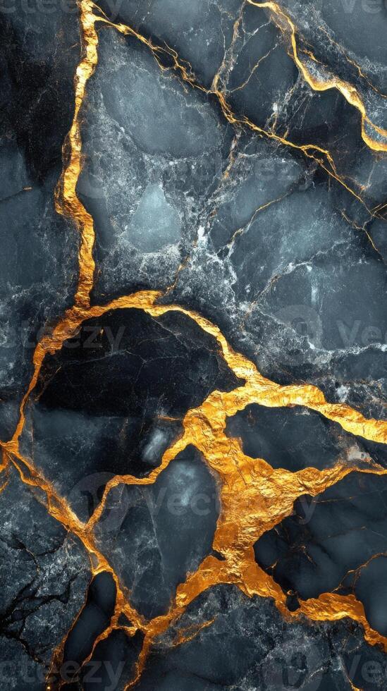 Dark stone surface with golden veins. Abstract background showing a natural stone pattern. Decorative wallpaper featuring streaks of shiny color. photo