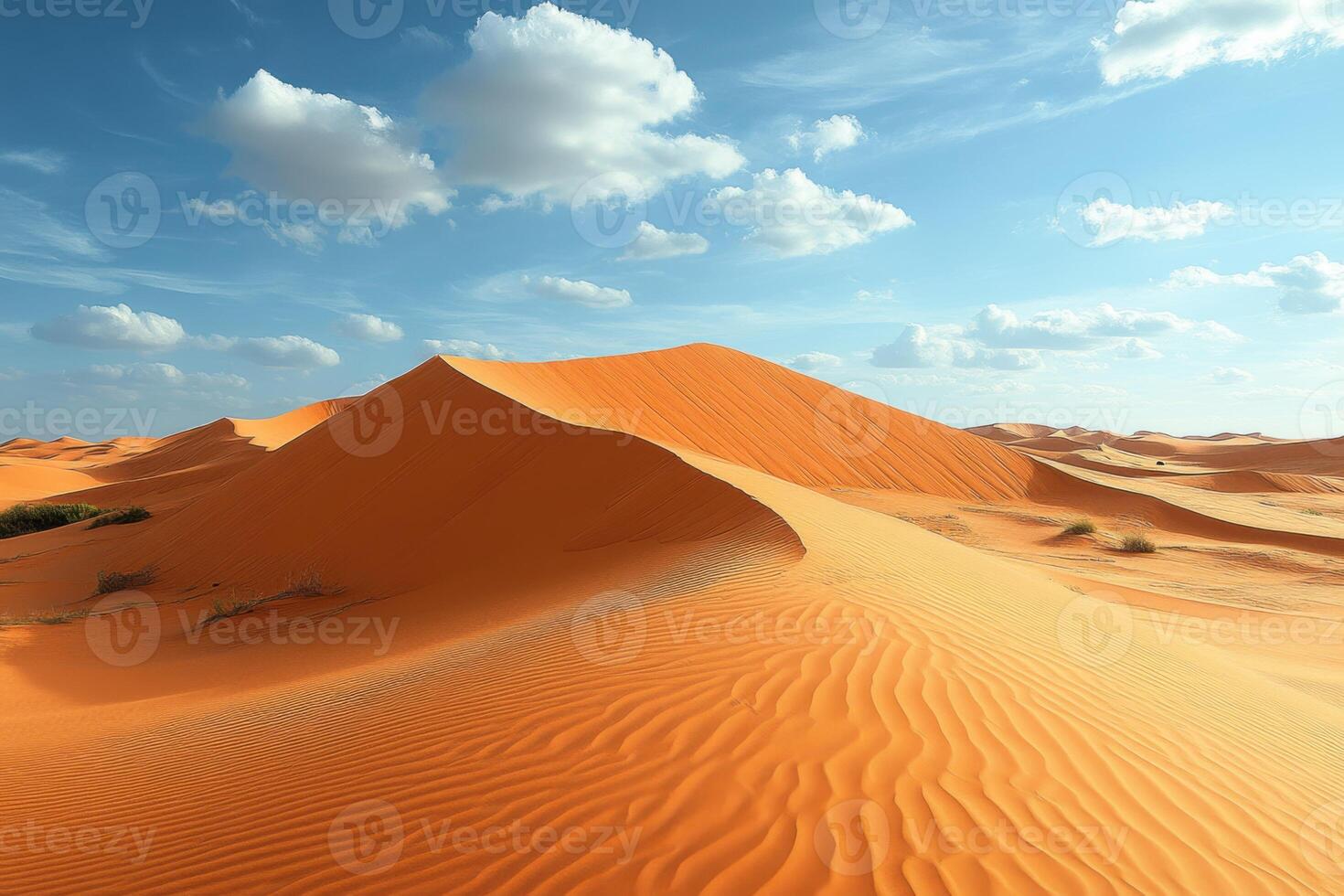 Desert landscape view with sand dunes. Blue sky with clouds above the arid land. Sand texture with ripple patterns on the slope. photo