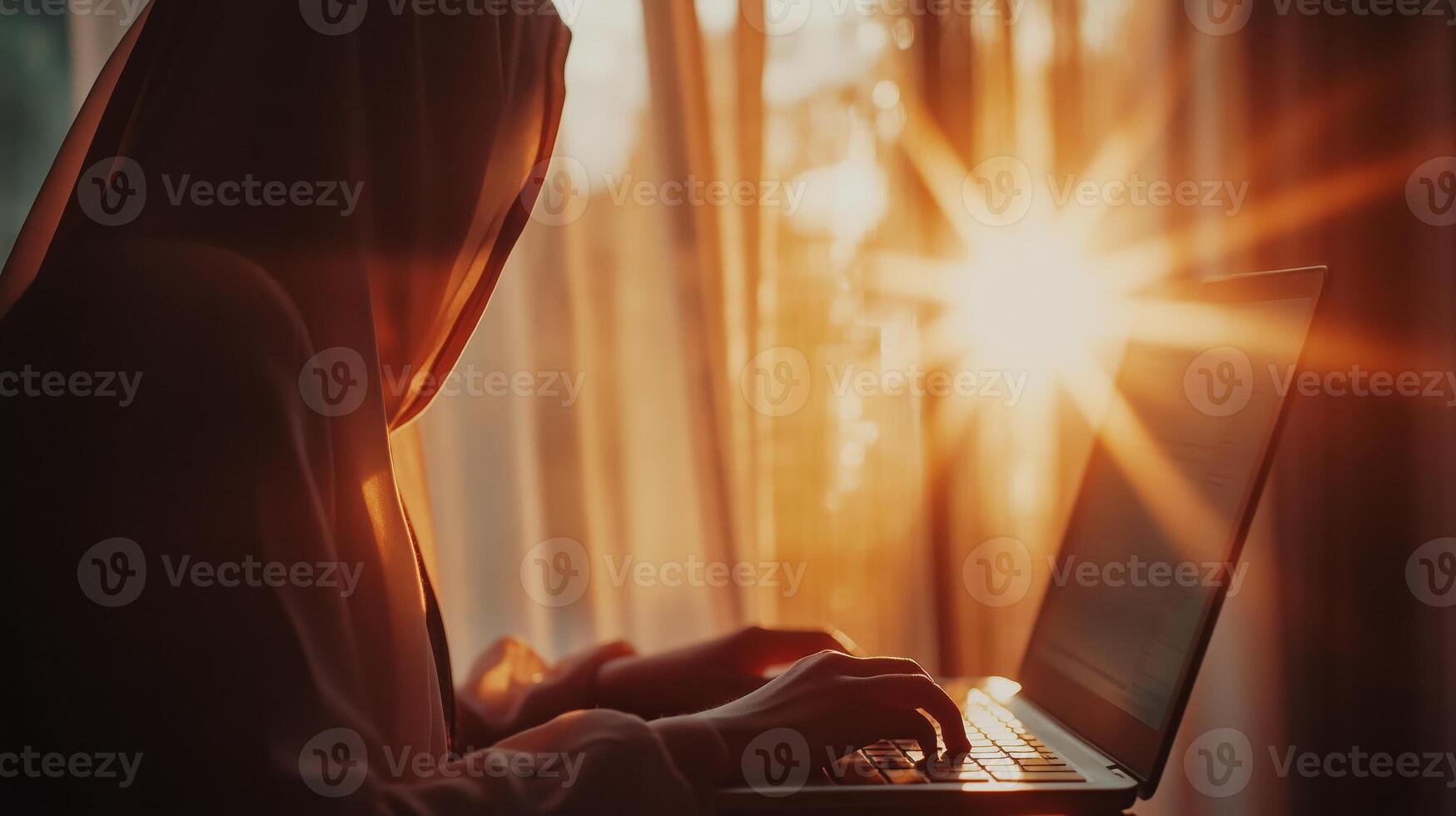 Beautiful muslim student girl using a laptop computer learning photo