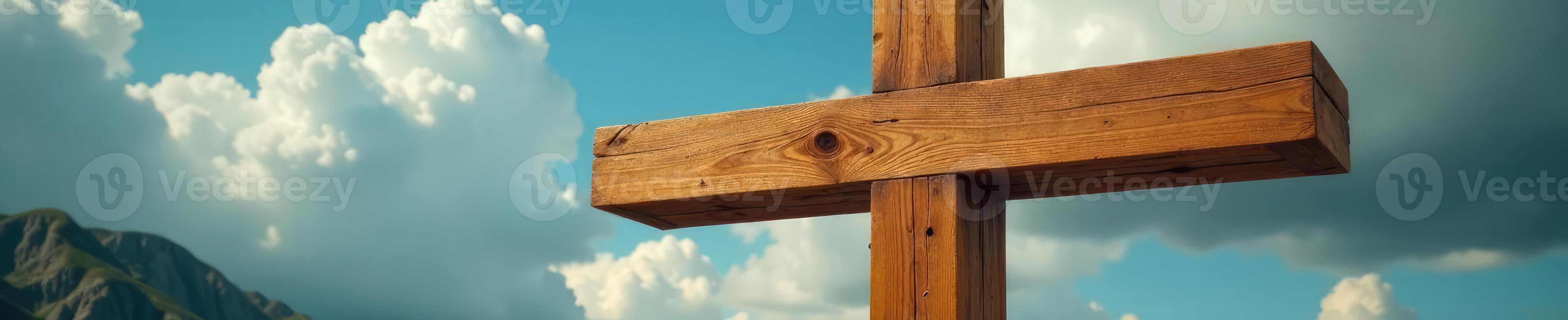 A wooden cross is standing in front of a cloudy sky photo