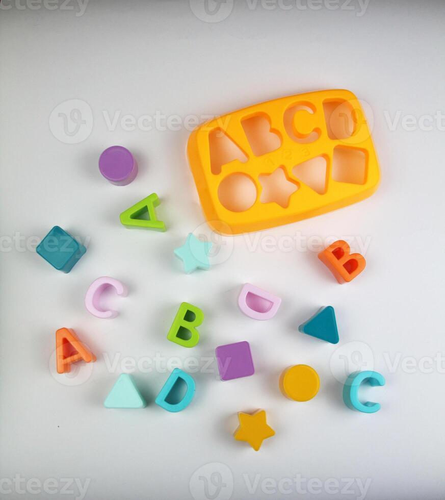 Sorter game with letters and figures. Concept of training. photo