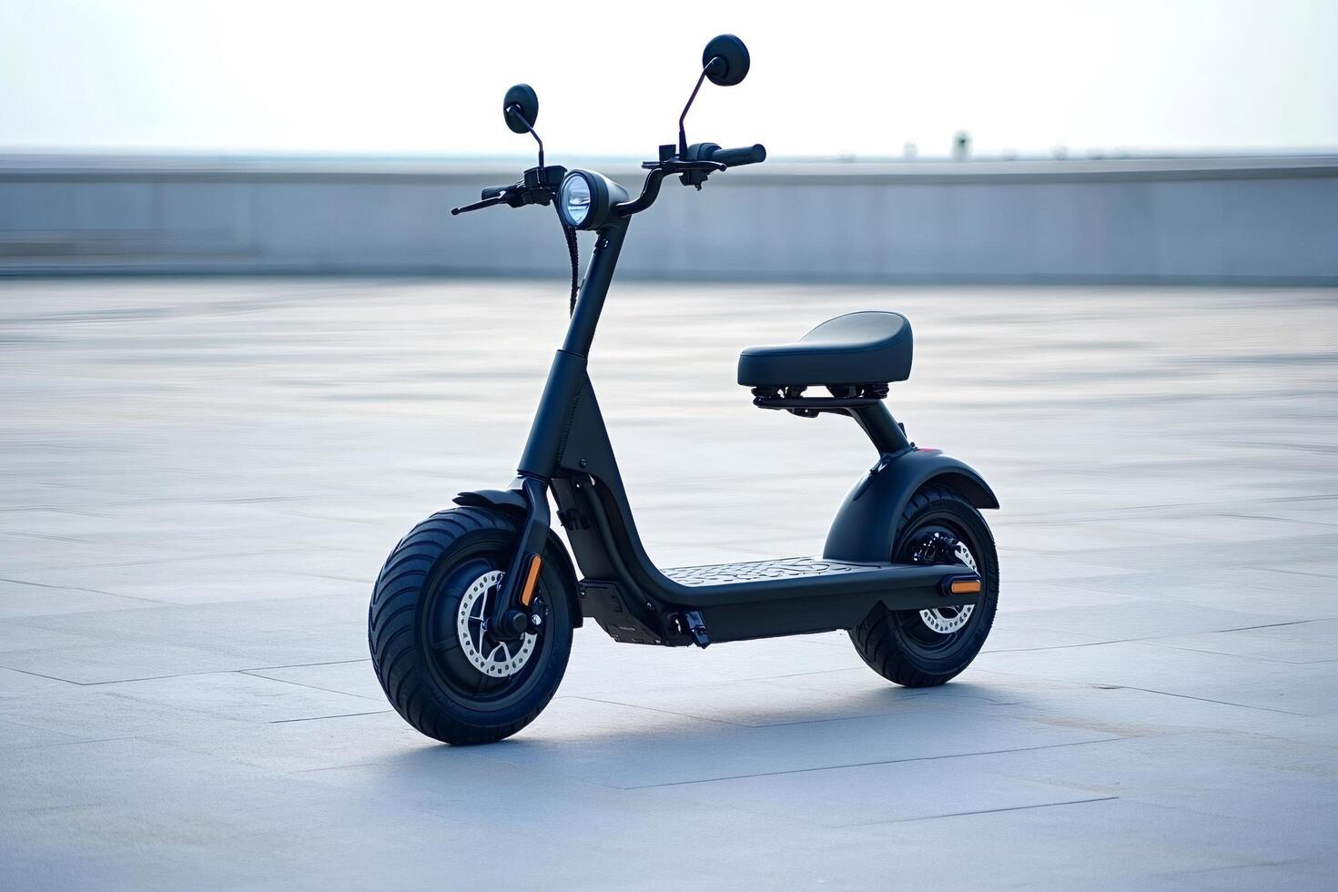 Modern black electric scooter parked on pavement in urban setting photo
