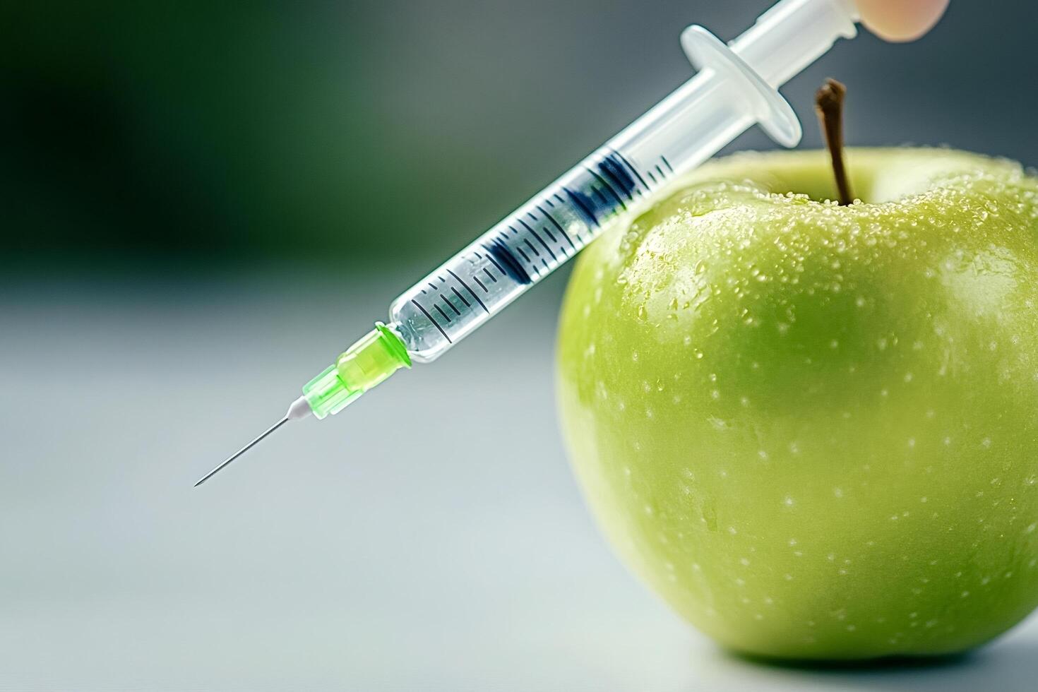 Syringe injecting green apple gmo food concept photo