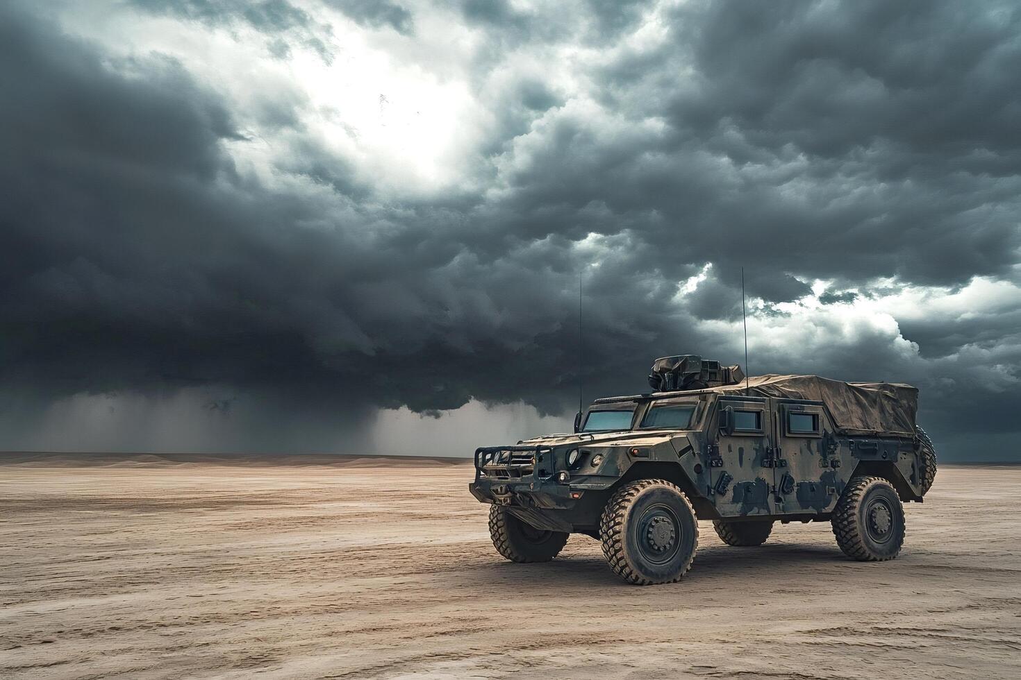 Military vehicle patrolling under dramatic stormy sky in desert photo
