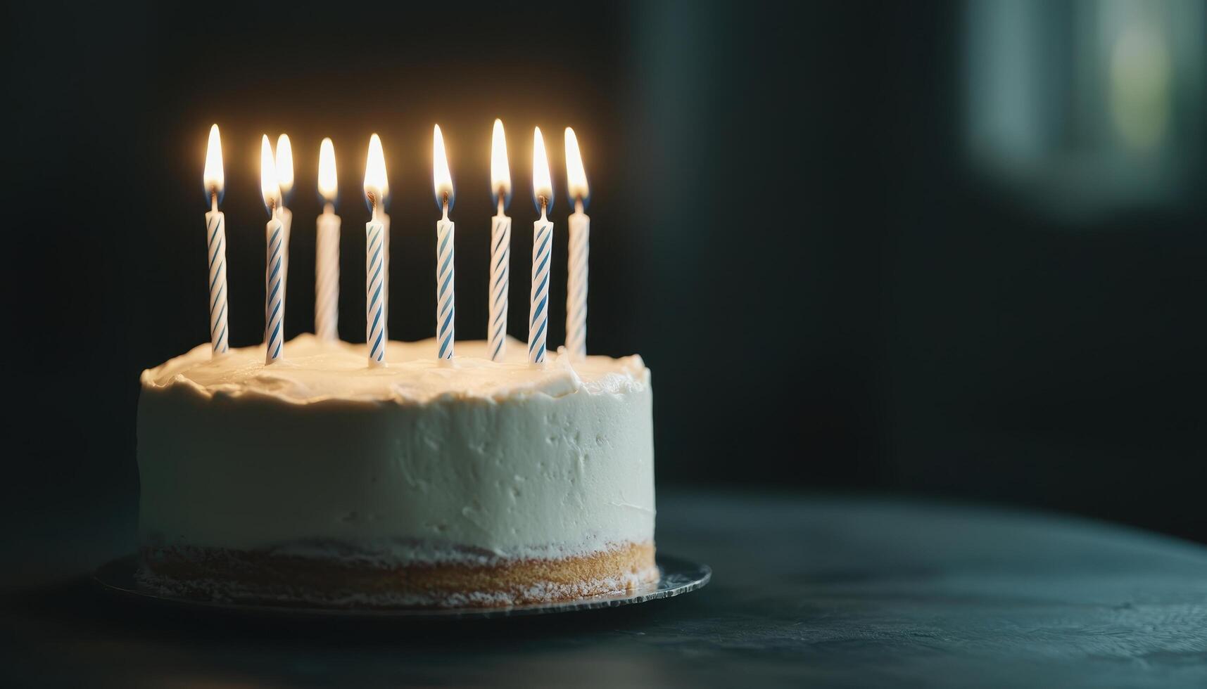 Birthday Cake with Lit Candles Dark Background Copyspace Festive Celebration Atmosphere photo