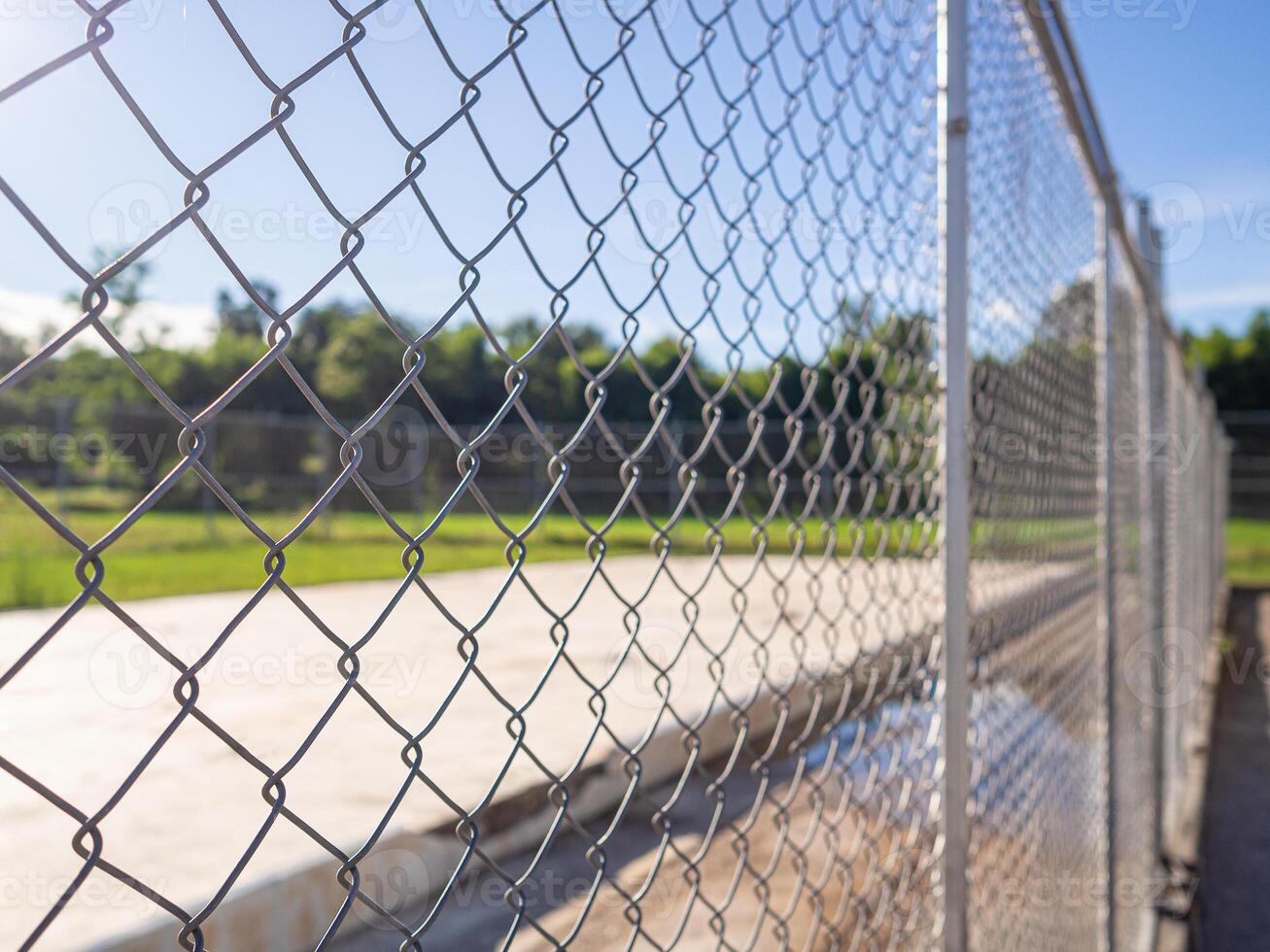 A selective focus shot of mesh fence photo