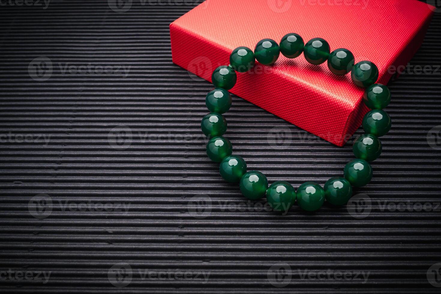 Close-up of Jade bangle or bracelet on a black background. photo