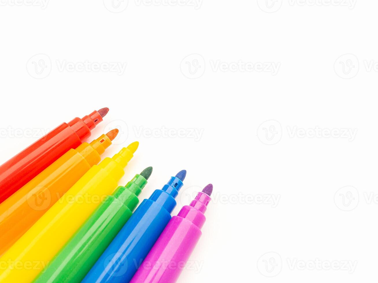 Close-up of watercolor pens on a white background. photo