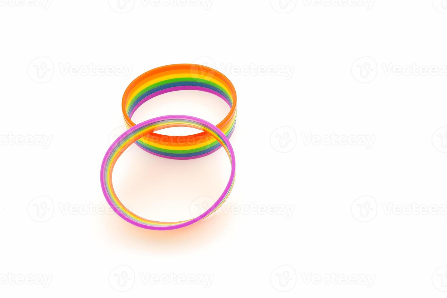 Close-up of a rainbow wristbands are on a white background. photo