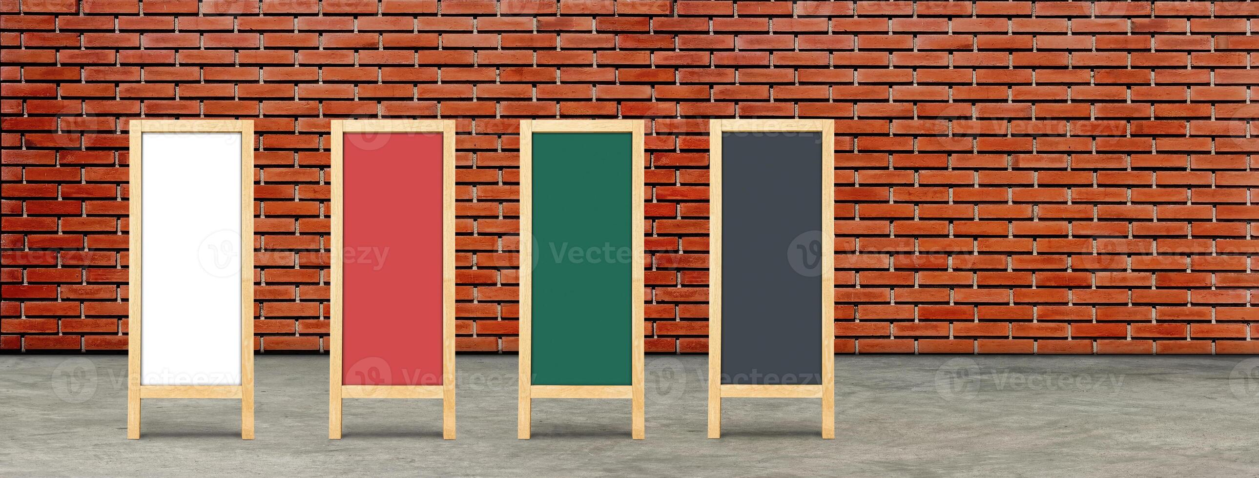 vintage wooden chalkboards with space for writing messages, red brick wall background. photo