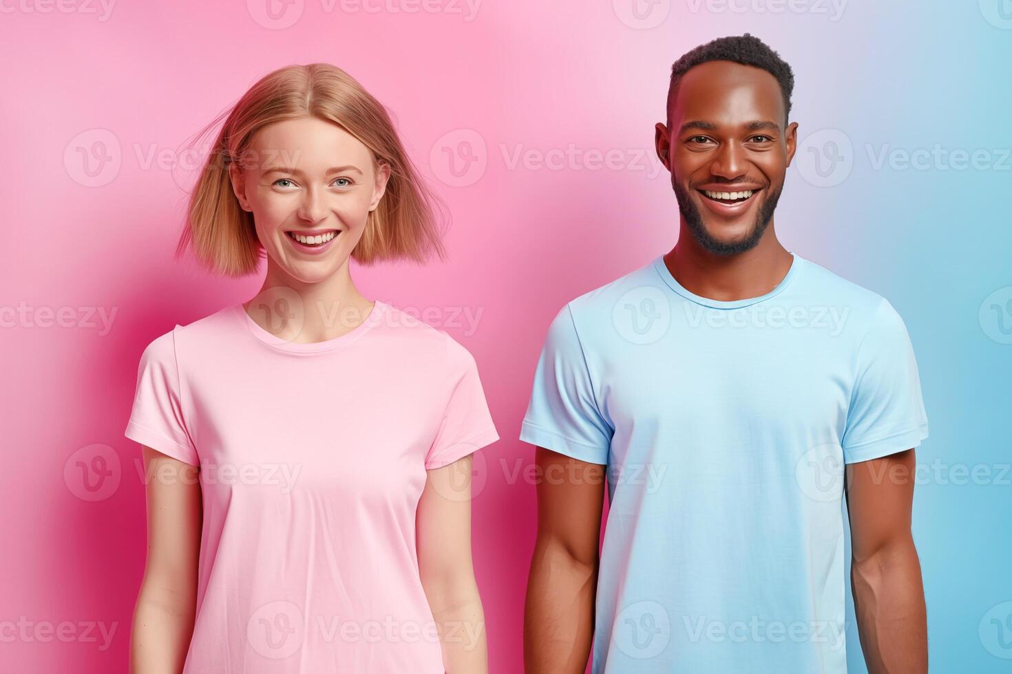 couple of young man and woman standing side by side smiling against pink blue gradient wall. couple themselves wearing pink t-shirt - white woman blonde, dark-skinned man in blue t-shirt photo