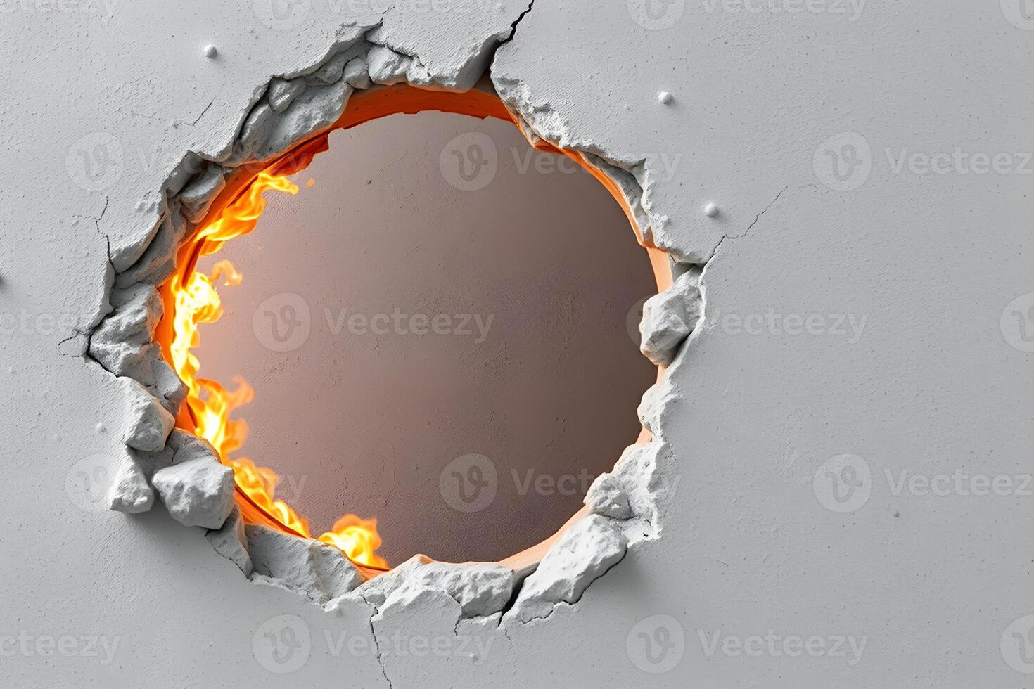 A circular hole torn through a white, cracked wall reveals flames, creating a striking contrast of destruction and fiery intensity. photo