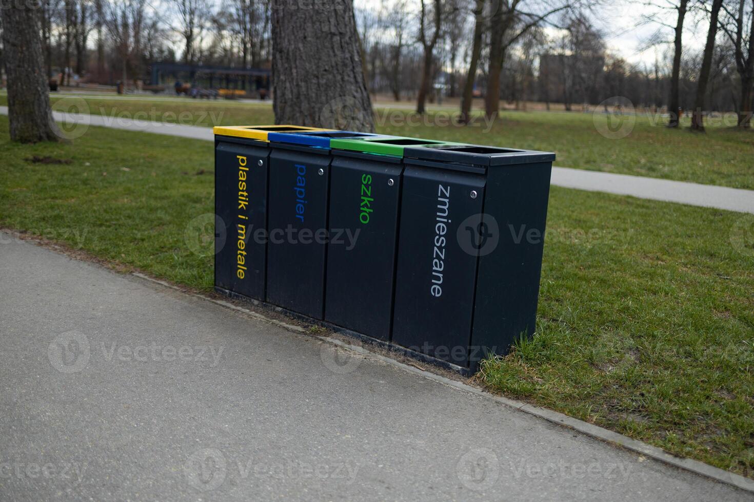 Trash Bins for Recycling in the Park, Different Containers for Waste Sorting photo