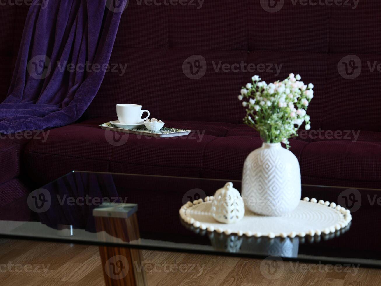An elegant and chic living room featuring a delightful floral arrangement and a stylish coffee set photo