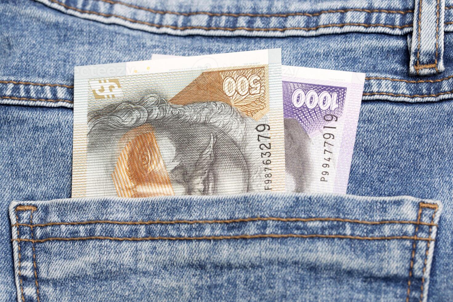 Slovak koruna in the pocket of blue jeans photo