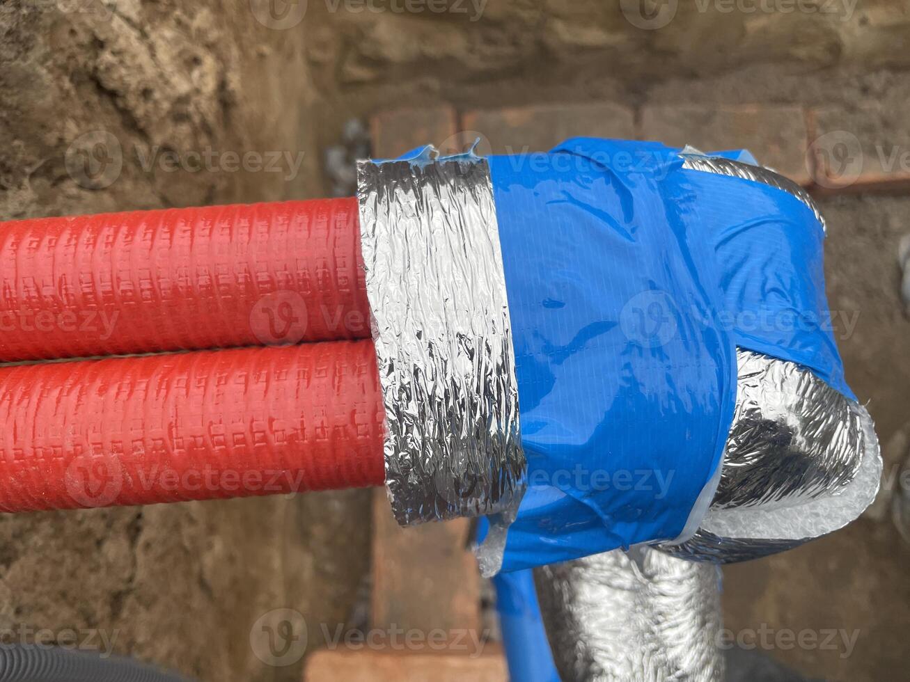 Insulating plumbing pipes with thermal foam wrap 6 photo