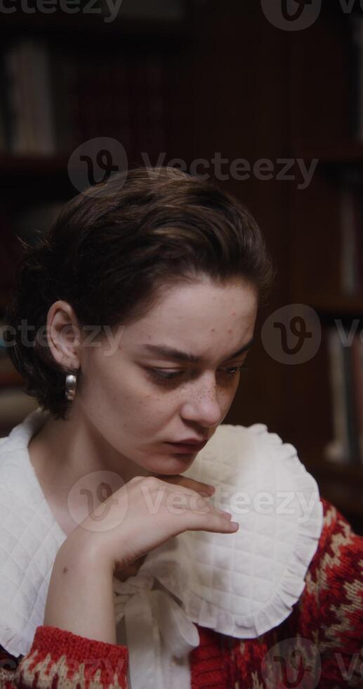 A woman wearing a red and white sweater photo