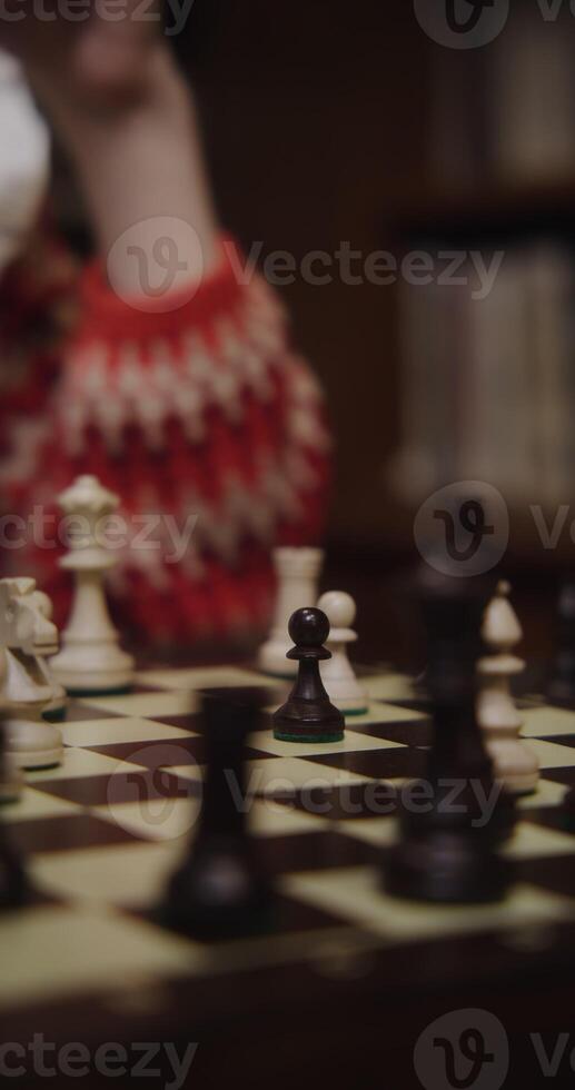 A person playing chess photo