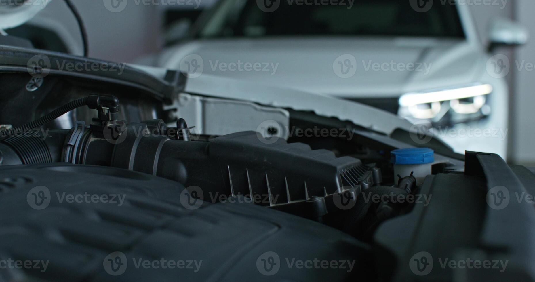 A car engine is shown with a blue light on it photo