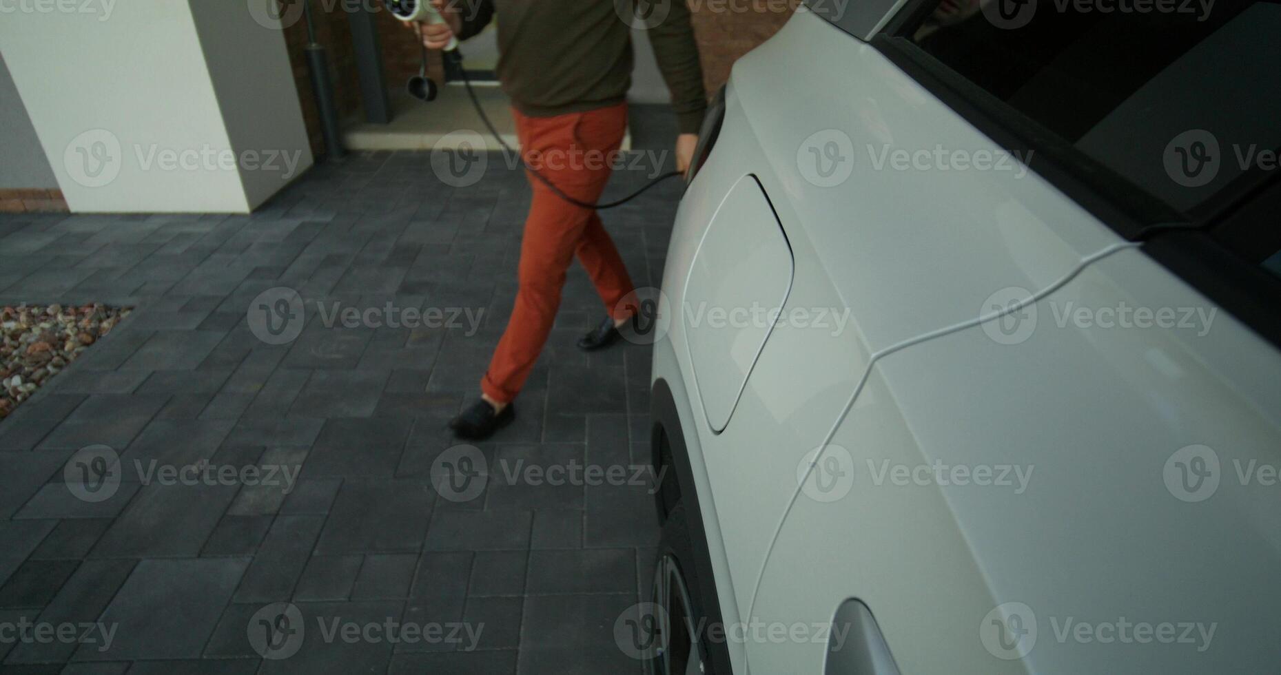 A man is walking near a car photo